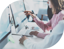 woman and man sitting at computer